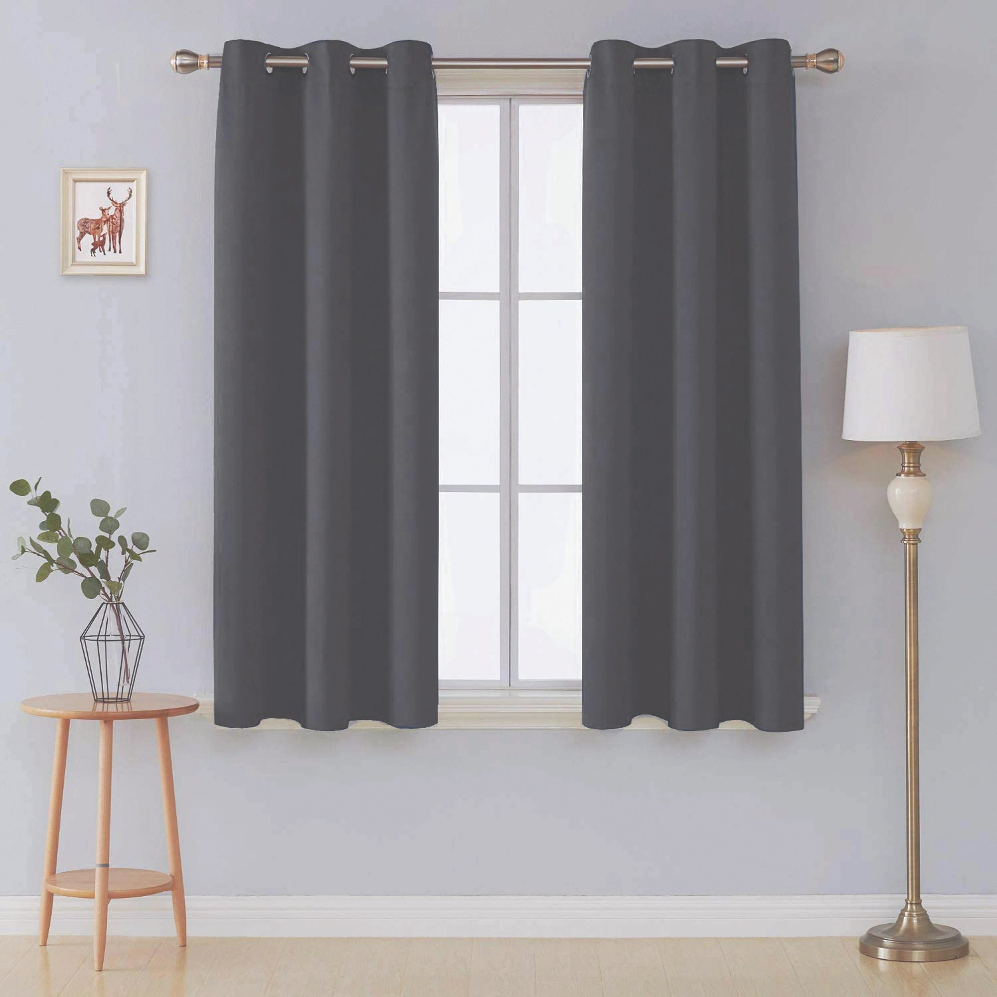 Front view of charcoal microfiber blackout curtains in a living room