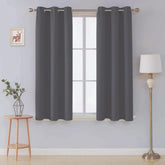 Front view of charcoal microfiber blackout curtains in a living room