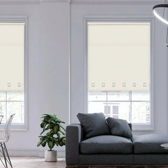 Natural light filtering through square eyelet roller blinds in a modern living room.