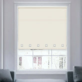 Full view of natural square eyelet roller blinds covering a window, allowing soft daylight through.