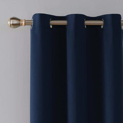 Close-up of metal eyelets on navy blue blackout curtain panel
