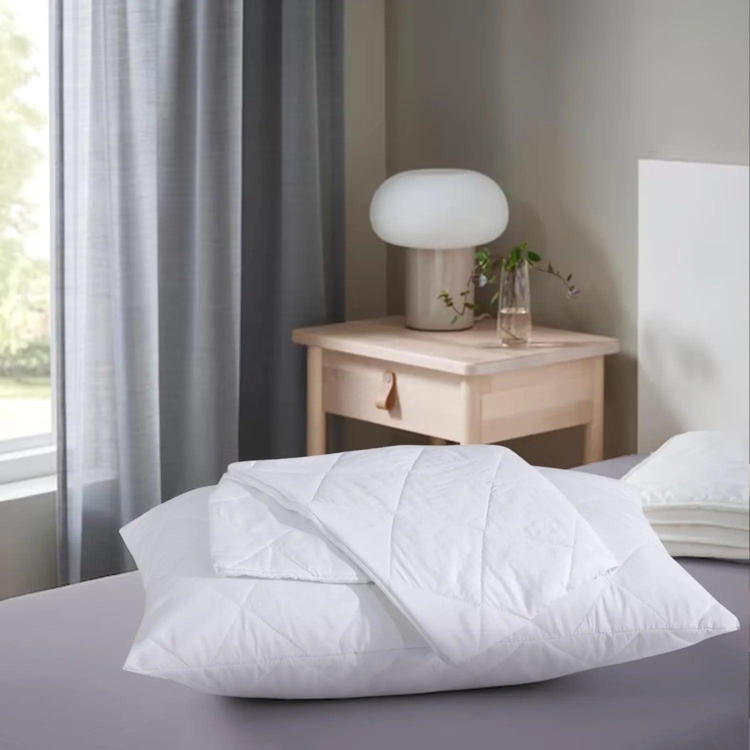 Front view of 2 quilted microfiber pillow protectors in white