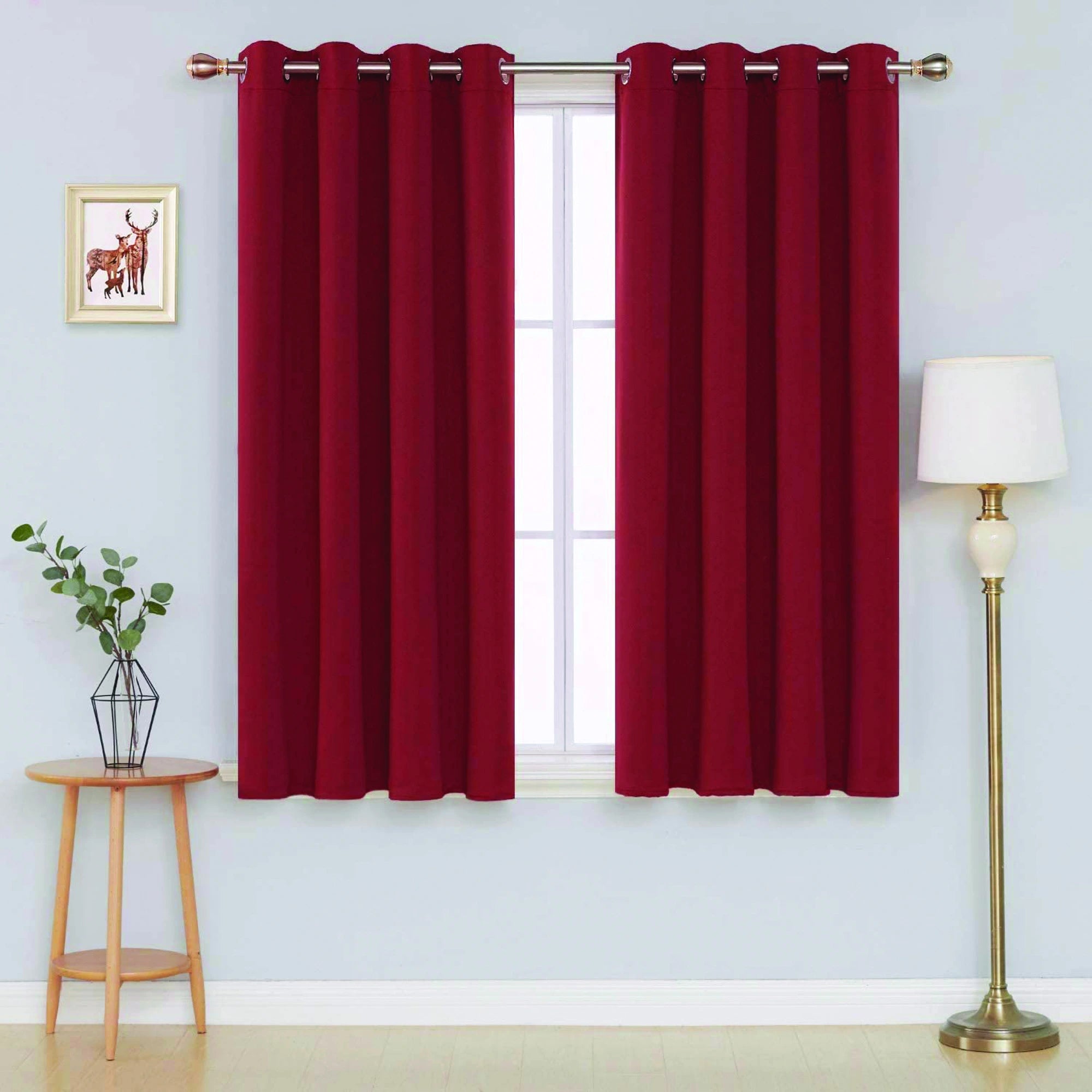 Front view of red microfiber blackout curtains hanging in a stylish room