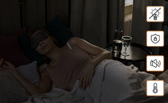 Silver blackout curtains styled in a cozy bedroom setting