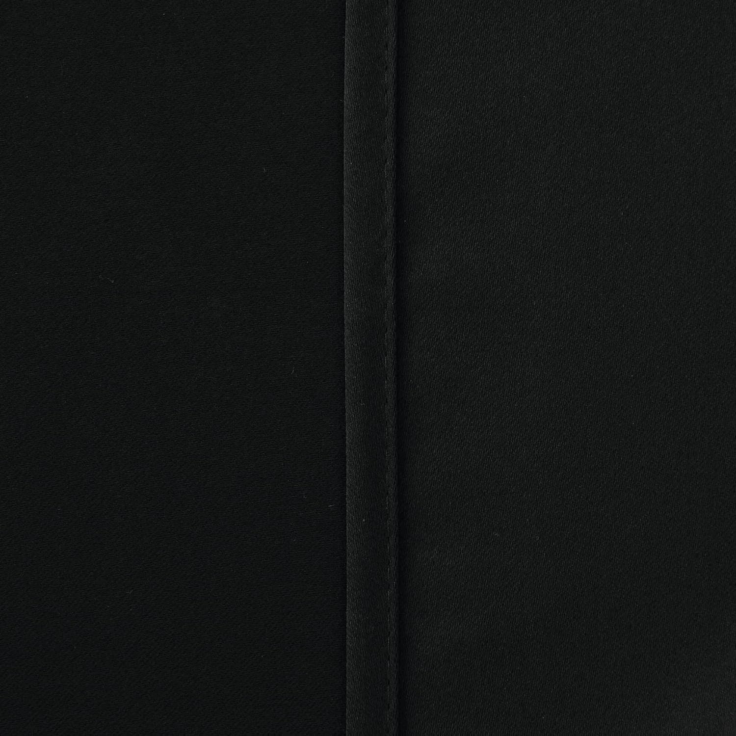 black blackout curtains tied back with matching accessories