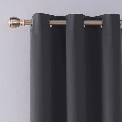 Close-up of silver eyelets on charcoal blackout curtain panel
