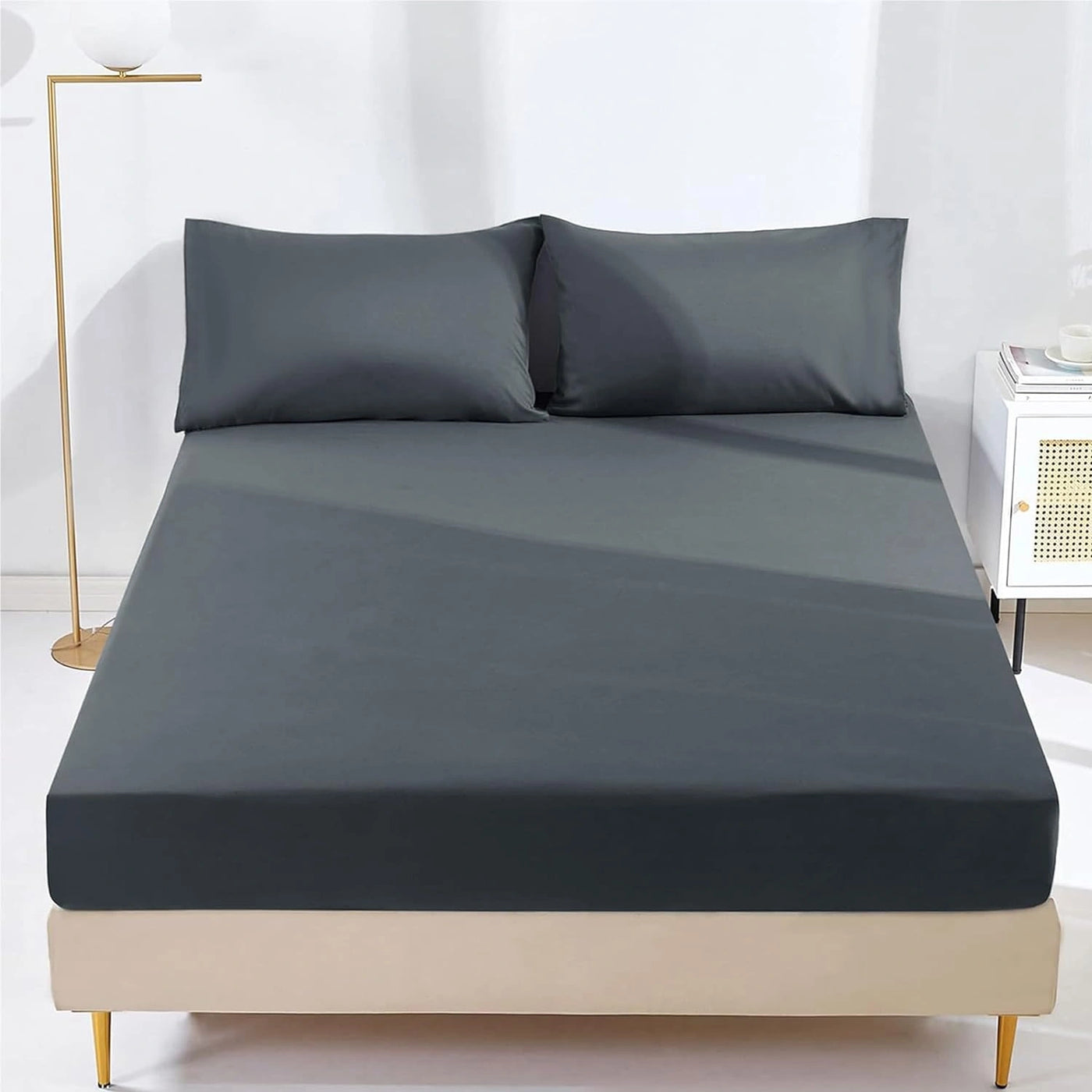 Microfiber fitted sheet snugly covering mattress
