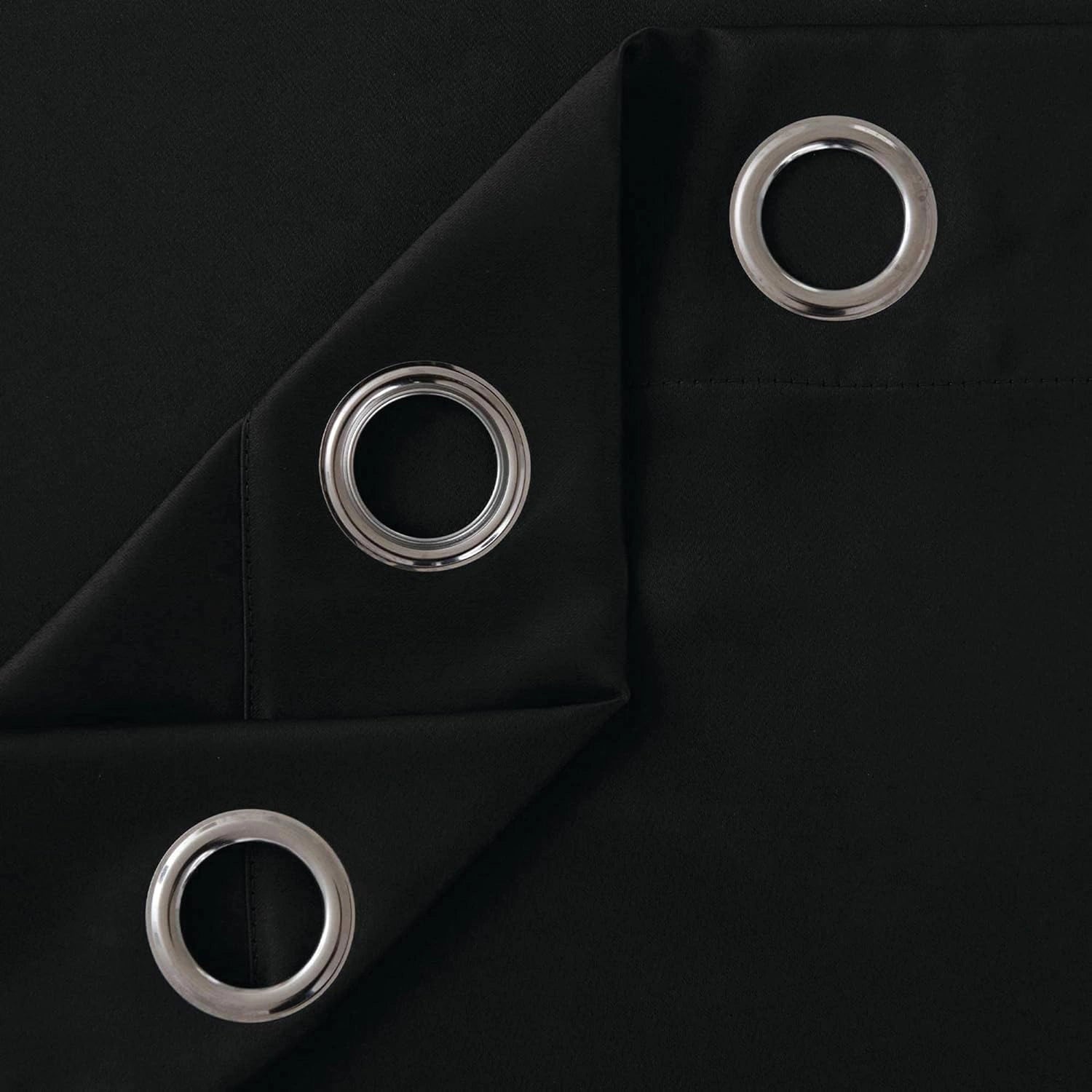Folded black microfiber curtains showing softness and quality stitching
