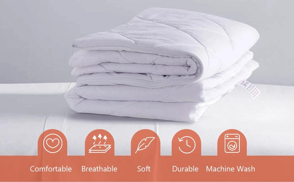  Quilted microfiber pillow protectors placed on a made bed