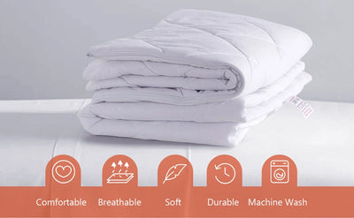  Quilted microfiber pillow protectors placed on a made bed