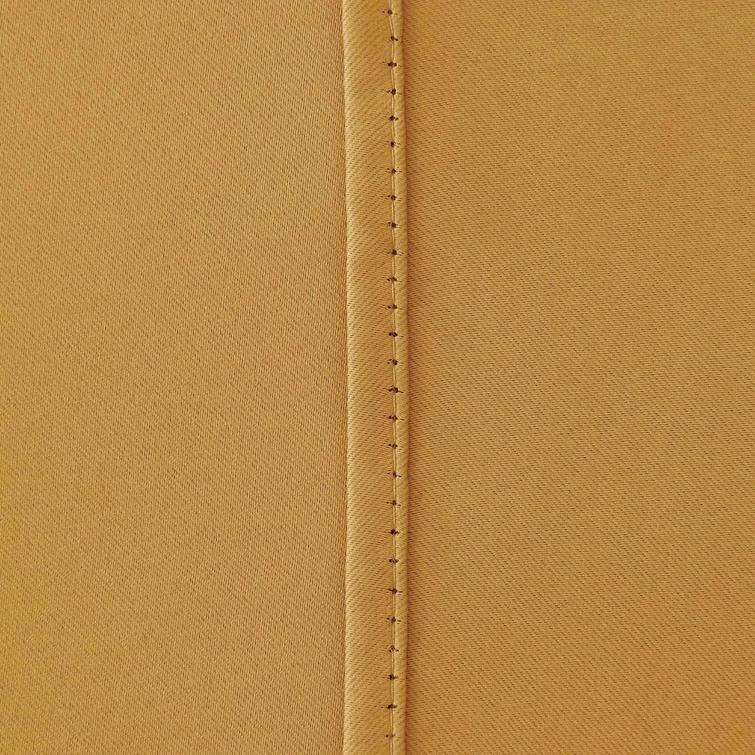 Ochre blackout curtains styled with matching tie backs