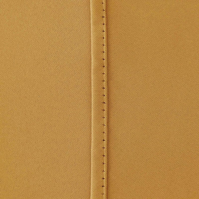 Ochre blackout curtains styled with matching tie backs
