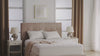 Soft microfiber mattress protector on a neatly made bed