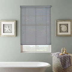Close-up of 50mm slats and decorative tape joins on grey faux wood blind